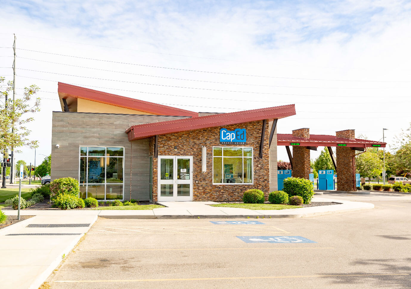 CapEd's Linder location front entrance from the sidewalk and handicapped parking zone.
