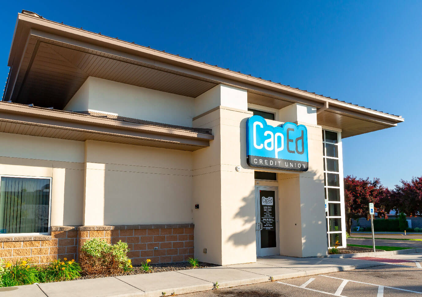 CapEd's Marketplace location front entrance from the sidewalk and handicapped parking zone.