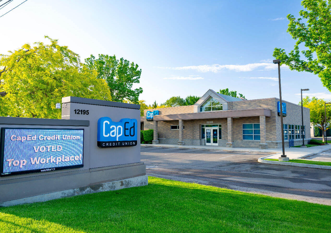 CapEd's McMillan location front sidewalk and grassy area.