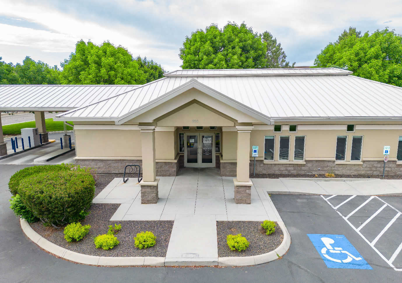 CapEd's Parkcenter location front entrance and handicapped parking area.