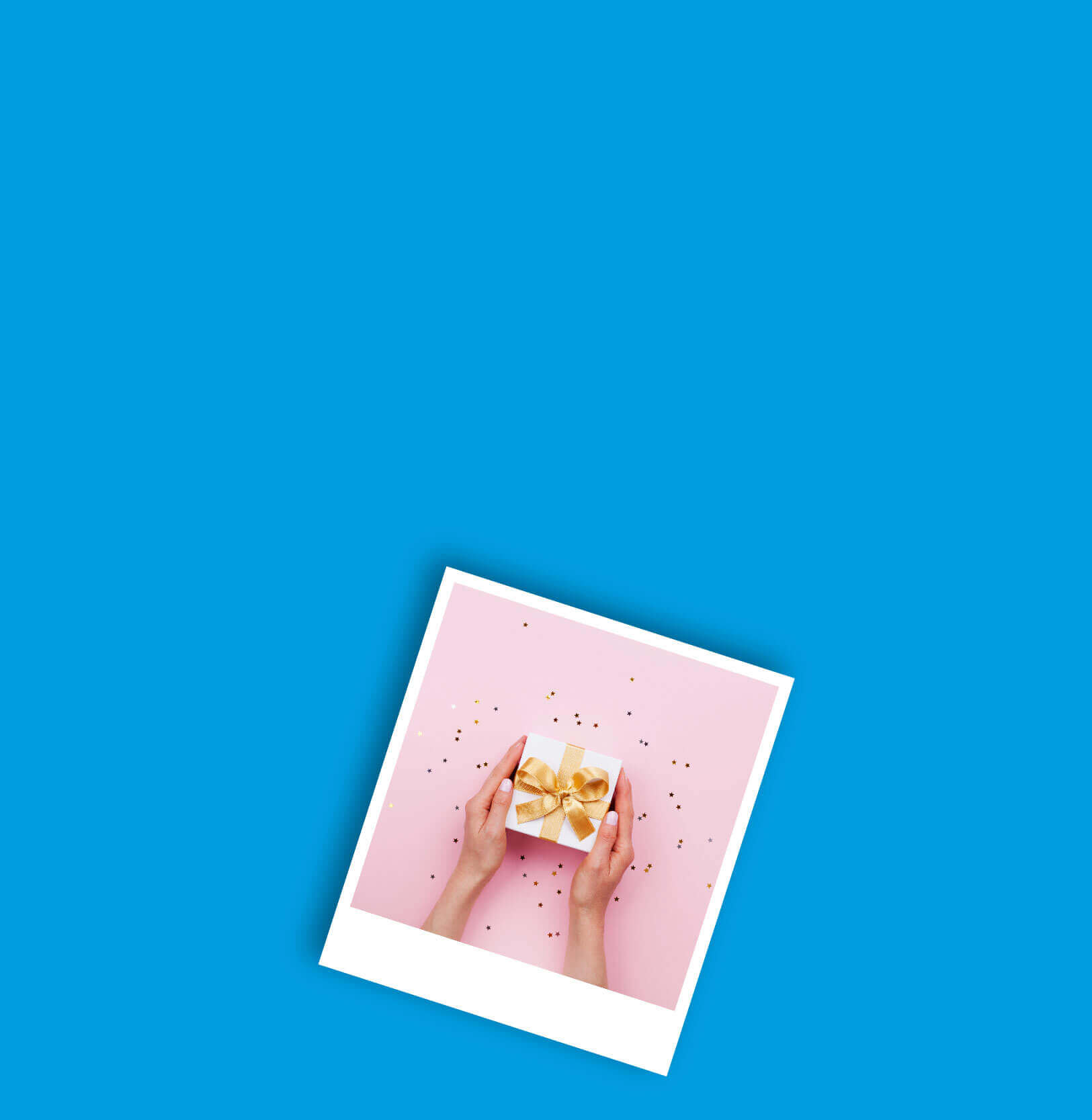 A pair of hands holding a giftbox containing a gift card.